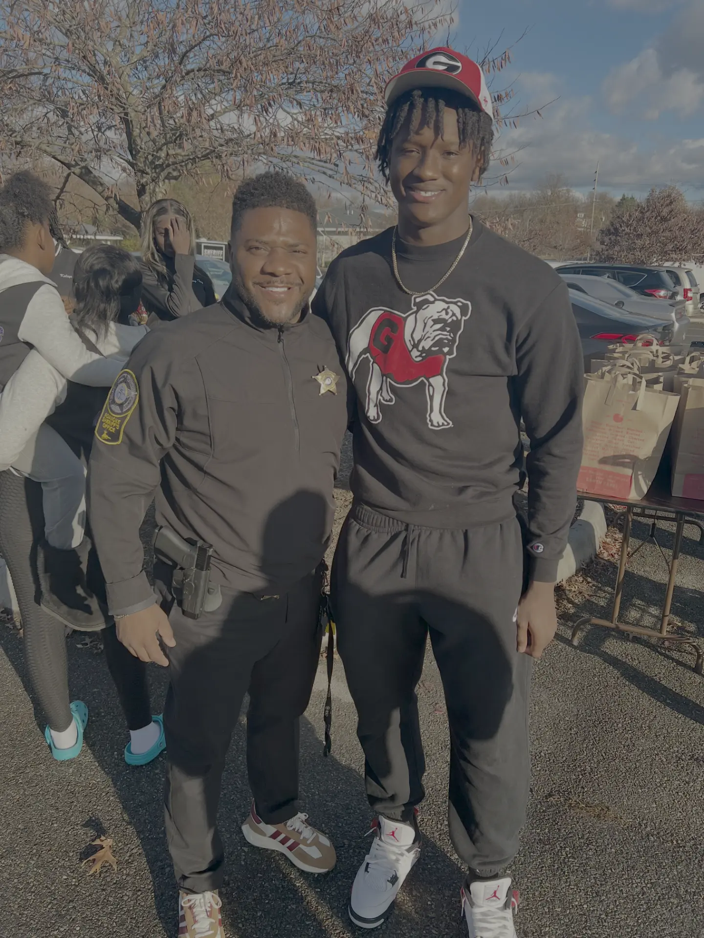 Chris Cole with a Roanoke County Sheriff's deputy at the Thanksgiving food drive